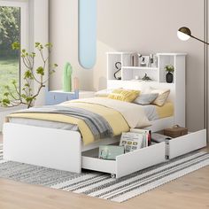 a white bed with two drawers underneath it