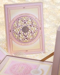 the inside of a pink and gold greeting card with an intricate design on it's front