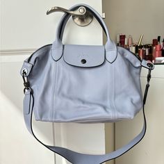 Leather Color Baby Blue New, Unused, No Flaws, No Odor. Dimensions : 9.8 In (L - Measured At The Base Of The Bag) X 9.1 In (H) X 6.3 In (W) Longchamp Le Pliage Sizes, Blue Longchamp, Longchamp Bag, Longchamp Bags, Longchamp Le Pliage, Baby Blue, Color Blue, Bag Lady, Handbags