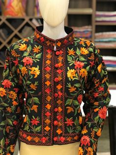 Suit up in Style with this Kashmiri bolero jacket. Product Details- Condition: Brand New (Made to order)- Fabric: Art Raw Silk - Base Color of Jacket: Black- Embroidery Color: Multi-Color Aari Embroidery- Fully Lined from Inside- Length: 20" (51 cms approx).- Care Instructions: Dry Clean Only.**If you want the jacket to be shorter or longer, just send us a message, and we will tailor it accordingly.**Colour customizations or change of fabric is also possible, just drop us a message.Sizing- Pleas Hippie Jacket, Traditional Jacket, Kashmiri Shawls, Flowing Dress, Aari Embroidery, Boho Jacket, Women Jackets, Jackets Women, Black Embroidery