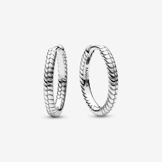 Create an instantly iconic look with the Pandora Moments Small Charm Hoop Earrings. These sterling silver earrings feature Pandora's famous snake chain pattern. These hoop earrings have a diameter of 18 mm, compared to the existing 25 mm style, and can hold one charm or dangle charm. Sleek on their own or personalized when paired with your favorite charms, these hoops are a style win. Please note that due to the smaller size and thickness of the hoops, some charms may not fit on these earrings. - Pandora Moments Small Charm Hoop Earrings - Sterling silver Earrings Pandora, Charms Pandora, Chain Pattern, Mesh Bracelet, Small Charms, Dangle Charms, Bracelets And Charms, Snake Chain, Chain Bracelet