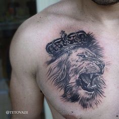 a man with a lion tattoo on his chest has a crown on it's head