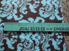 a ruler is on top of a piece of fabric