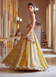 Editor's Note Hand Embroidered Panelled Lehenga Set With Zardosi Details And French Knots Fabric: Organza Color: Honey Gold Care: Dry Clean Only About the Designer A melange of rich embroideries, appliques, impeccable weaving, brilliant printing, and dyeing, Osaa by Adarsh is a story of India’s rich textile traditions replicated to form wedding couture. Adarsh Makharia saw the endless opportunities to engage the diverse artisans and designs and, with Osaa, weaved together a celebration of India’ Gold Organza, Organza Lehenga, Red Lehenga, Embroidered Organza, French Knots, Designer Lehenga Choli, Bridal Lehenga, Lehenga Choli, Sheer Blouse