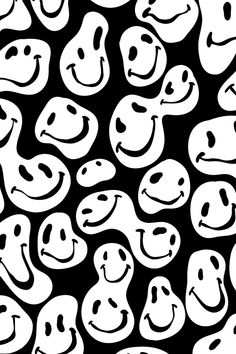 a black and white pattern with smiley faces