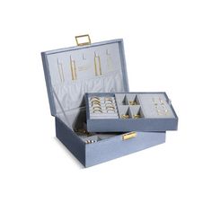 an open box with jewelry in it on a white background