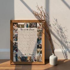 a wooden frame with a poem on it next to a vase filled with dried flowers