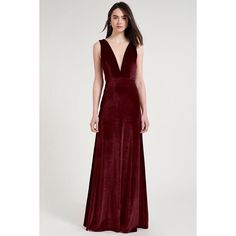 a woman in a long velvet dress