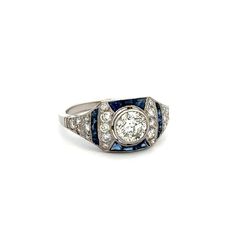 Indulge in luxury with this exquisite Platinum Diamond, Sapphire & Diamond Filigree Milgrain Ring from Regard Jewelry Austin, Texas. Made with .76ct Diamond, .48tcw Sapphire & .55tcw Diamond, this elegant ring is perfect for adding sophistication to any outfit. Weighing only 4.3g and in size 6.75, it is a lightweight and comfortable accessory.