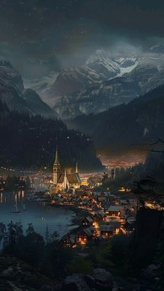 a night view of a town with mountains in the background and lights shining on it