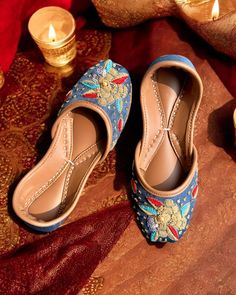 Discover timeless tradition and modern elegance with our handcrafted jutti collection, perfect for any occasion. From weddings to everyday wear, our shoes offer style and comfort in perfect harmony. Choose from a variety of traditional and contemporary designs, including our popular blue Jutti and Khussa options, made with the highest quality materials and attention to detail. Blue Traditional Wear With Gota Work For Festive Season, Festive Blue Traditional Wear With Gota Work, Blue Traditional Wear With Dabka For Festive Occasion, Blue Dabka Traditional Wear For Diwali, Blue Traditional Wear For Festive Occasions, Blue Festive Traditional Wear For Celebration, Festive Blue Traditional Wear For Celebration, Blue Traditional Wear With Gota Work, Blue Traditional Wear With Meenakari For Festivals