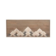 a wooden wall hanging with white and grey chevrons