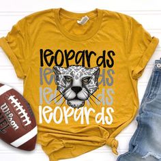 a t - shirt that says leopards and has an image of a cat on it