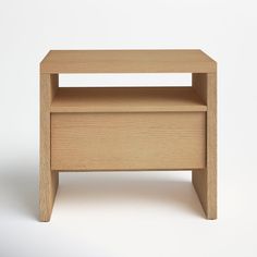 a small wooden table with one shelf on the bottom and two shelves below it, against a white background