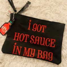 “I Got Hot Sauce In My Bag” Wristlet Clutch Never Used, Brand New With Tags. Purchased At Macy’s. Pretty Spacious Clutch. No Pockets Or Zippers Inside. Gift Black Pouch With Zipper Closure, Black Pouch With Zipper Closure As Gift, Black Rectangular Wristlet For Gift, Rectangular Black Wristlet For Gift, Rectangular Black Wristlet As A Gift, Black Wristlet With Zipper Closure As Gift, Black Wristlet With Zipper Closure For Gift, Pouch Wristlet With Zipper Closure For Gift, Black Clutch Wristlet For Gift