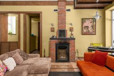 a living room filled with furniture and a fire place