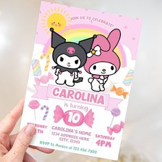 a person holding up a card with an image of two cartoon characters on it and the text, carolina is turning 10