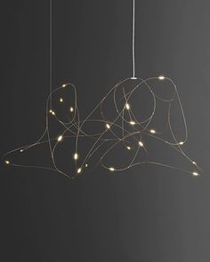 a light hanging from the ceiling with string lights