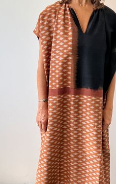 A longer caftan in gorgeous terracotta Ikat with black trim.  This is a mid weight hand woven cotton fabric with opaque coverage. A perfect piece to be worn on its own as a dress or as a fabulous coverup for the beach. Custom fabric design by Two Ikat weave Hand spun cotton Length 49"  Width 33" Kantha Jacket, Boho Beachy, Mid Dresses, Woven Cotton, Black Trim, Sewing Inspiration, Simple Dresses, Cotton Weaving, Hand Woven