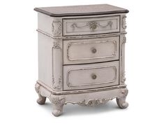 an antique white nightstand with two drawers on one side and a drawer on the other