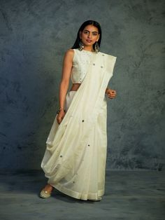 Off White Chanderi Saree With Sleeveless Blouse (Set of 2) By Charkhee now available at Trendroots Saree With Sleeveless Blouse, Off White Saree, Chanderi Saree, White Saree, Sustainable Clothing Brands, Embroidered Saree, Saree Photoshoot, White Mirror, Bridal Sarees