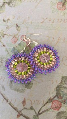 Lavender Starburst Bloom Seed Bead Earrings Beaded by WorkofHeart Purple Faceted Beaded Round Earrings, Purple Faceted Beaded Earrings, Lavender Drop Beaded Earrings, Lavender Beaded Drop Earrings, Pink Beaded Earrings With Bead Caps, Purple Beaded Earrings With Colorful Beads, Purple Dangle Beaded Earrings With Spacer Beads, Green Beaded Crystal Earrings With Round Beads, Purple Round Beaded Earrings With Ear Wire