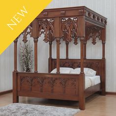 an ornate wooden bed frame in a room with hardwood flooring and walls painted white