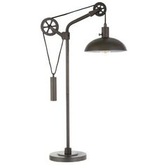 an industrial style desk lamp with a black shade on the top and a white background