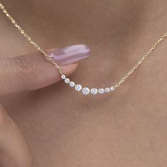 Elevate your style with our dainty 14k Curved Bar Diamond Necklace. This minimalist and handcrafted piece features a delicate bar pendant adorned with sparkling diamonds, making it the perfect wedding gift for her. Embrace the elegance and timeless beauty of this handmade diamond jewelry. Order now and make a statement of sophistication! Alternatively, choose from our options of natural, lab-grown diamonds or dazzling moissanites at three different price points to fit your unique preferences and budget. Please check below to see specifications of each stone option. Each piece is accompanied by an Azalea Certification and Warranty document, ensuring that you receive a high-quality, authentic piece of fine jewelry. Please message us if you don't receive your certification with your piece. M 3 Diamind Necklace Horizontal, Luxury Minimalist Diamond-shaped Jewelry, Diamond Necklaces Design, Luxury Dainty Diamond Necklace With Baguette Diamonds, Lab Diamond Necklace, Everyday Diamond Jewelry, Dainty Yellow Gold Bar Necklace, Delicate 14k Gold Bar Necklace, Minimalist 14k Gold Bar Necklace For Anniversary