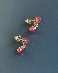 9ct Yellow Gold Ruby Earrings Pear Drop Studs 1.20ct 6x4 mm pear cut set with round cut combined carat 1.20ct Deep shade of pink red Ruby for coloured gems lover Hallmarked 9ct 375 Just under 2g Please see pics for measures "Free Next-day UK Delivery Safe, secure and insured delivery from our reliable delivery partners "What You See is What You Get" Promise Every photo you see is of the actual item. No trick lighting or editing" Ruby Earrings Gold, Studs Gold Earrings, Gold Ruby Earrings, Red Ruby Earrings, Small Earrings Gold, Coral Jewelry Set, Ruby Stud Earrings, Ruby Earrings Studs, Gold Earrings Models