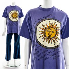 - Purple Short Sleeve T-Shirt - Sun Design with Sun Facts - Cool 90s Vintage TEE Fits like:  Medium Material:  Cotton Condition:  Good to Great Clipped on Mannequin:  Yes ✂ SIZE + FIT ✂ Length: 30" / 76 cm Shoulders, seam to seam: 19" / 48 cm Sleeve Length: 8" / 20 cm Bust: 40" / 102 cm Waist: 40" / 102 cm All measurements are taken with garment lying flat. ALWAYS refer to measurements as vintage sizes can vary greatly from today's modern sizes. We recommend comparing measurements above with a s Sun Facts, Vintage Purple T-shirt For Summer, Vintage Purple Relaxed Fit Tops, Vintage Purple Graphic Print Top, Celestial Style Graphic T-shirt For Summer, Celestial Vintage, Bohemian Short Sleeve T-shirt With Sun And Moon Design, Bohemian Cotton T-shirt With Sun And Moon Design, Celestial Moon Print Crew Neck T-shirt