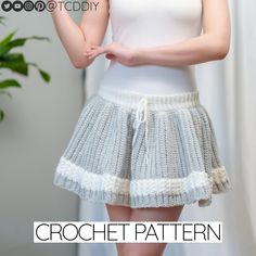 a woman is wearing a skirt made from crochet and has her hands on her hips