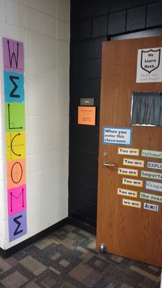 the door to an office is decorated with sticky notes and words that spell out welcome