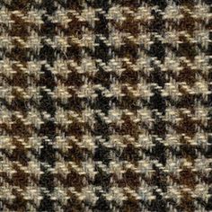 a brown and white checkered pattern on fabric