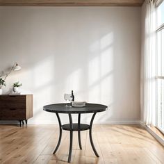 an empty room with a table and two vases sitting on the floor next to it