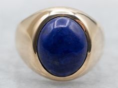 Show off your personality with this beautiful yellow gold bezel set oval cut lapis solitaire ring! The perfect combination of sparkle and sophistication, you'll love the unique shape and deep blue color of this statement piece! Wear it day or night for some extra wow-factor! Metal: 10K Yellow Gold Gem: Lapis 2.59 Carats Gem Measurements: 8.5 x 10.2 mm, Oval Ring Size: 4.25 Marks: "10K" Stamped on the inside band SKU #: A35957 Each piece has been identified and graded by a Graduate Gemologist who Lapis Ring, Oval Ring, Oval Rings, Ring Gold, Color Azul, Bezel Setting, Solitaire Ring, Statement Ring, Rings Statement