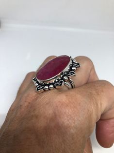 Unusual deep toned raw Ruby low content silver setting handmade size 8 Can be resized. My jeweler charges a $10- $20 fee All rings are shipped in a nice gift box. Check out our over a THOUSAND great reviews Engraving is $4 per letter and is not always perfect depending on the piece. It can take a few days if the jeweler is busy. This is payable to Paypal Judithsltd@gmail.com Raw Ruby, Gothic Ring, Pink Ruby, Gothic Rings, 20 Gifts, 925 Sterling Silver Ring, Lovely Gift, Vintage Rings, Rose Quartz