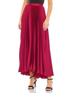 Transform your evening look with our Long Pleated Satin Maxi Skirt. This skirt is perfect for black-tie events, galas, or formal charity fundraisers. Pair it with a sophisticated blouse or top and elegant accessories for a regal look. Mac Duggal Satin Fabric (100% polyester) Fully lined Pleated detailing Back zipper Approx. length: Front: 38.5" | Back: 43" Available in Black, Peacock, and Fuchsia Style #R26760 Satin Pleated Skirt, Vestidos Color Coral, Junior Formal Dresses, Emerald Bridesmaid Dresses, Tea Length Skirt, Color Peacock, Satin Maxi Skirt, Prom Dress Plus Size, Plus Size Cocktail Dresses