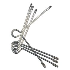 four metal knitting needles on a white background