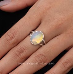 Ethiopian Opal Ring, 925 Sterling Silver Ring, Handmade Ring, Women Silver Jewelry, Statement Ring, Oval Gemstone Ring, Ring For Women.   Gemstone Name - Ethiopian Opal  Stone Quality - AAA  Ring L - 1.5 CM RING W- 1.2 CM Weight - 4.31 gm Stone Shape- As shown in the picture We serve complete 925 sterling silver Jewelry and genuine properties of the stone.  The products are dispatched from the small business from UK. Product Quality and Packaging - Our all products are 925 Silver Stamped which shows that the product is genuine and authentic .The products are dispatched from the small business from UK so you get the product on time and the product packaging comes in bubble foil wrap with all the precautions taken primarily that your product reaches you with zero damage. Healing Properties o Oval Moonstone Gemstone Stackable Rings, Oval Opal Stackable Rings, Oval Moonstone Stackable Rings With Gemstone, Stackable Rings With Moonstone Gemstones, Oval Sterling Silver Crystal Ring, Oval Hallmarked Sterling Silver Crystal Ring, Hallmarked Oval Crystal Ring In Sterling Silver, Hallmarked Oval Crystal Sterling Silver Ring, Silver Oval Crystal Ring