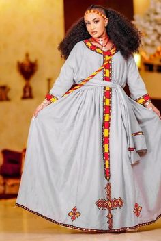 Introducing the captivating Habesha dress, also known as Habesha Kemis, a beautiful attire that embodies the elegance and cultural richness of Ethiopia. The Habesha dress is a testimony to the unique identity and enduring beauty of Ethiopian culture. Experience the allure of the Habesha dress and embrace your individuality with this exceptional piece of Ethiopian fashion. #ethiopiandress #habeshadress #habeshakemis Modern Habesha Dress, Ethiopian Fashion, Ethiopian Culture, Eritrean Dress, Habesha Dress, Ethiopian Traditional Dress, Ethiopian Dress, Habesha Kemis, Historical Dress