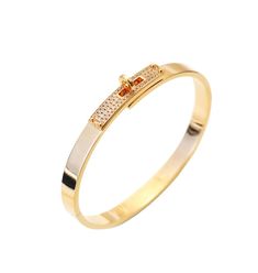 a yellow gold ring with two rows of diamonds