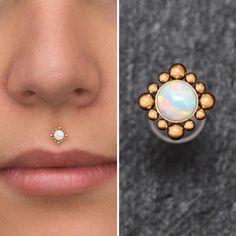 a woman's nose and nose ring with an opal stone in the middle