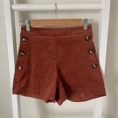 ***Boutique Brand*** Nwt These Shorts Are So Boho And Stylish! Pair With Your Favorite Boho Hat And Booties For A Super Cute Look! ~~~~~ -Size Small -True To Size -Stretchy Waist Band -Button Details On Pockets -Pockets Not Functional -Corduroy Feel -Super Comfortable ~~~~~ 100% Cotton #35 Chic Brown Button-up Bottoms, Chic Cotton Bottoms With Snap Buttons, High Waist Brown Corduroy Shorts, Brown High Waist Corduroy Shorts, Brown High-waisted Corduroy Shorts, Casual Brown Button-up Bottoms, High Waist Corduroy Bottoms With Buttons, Corduroy Bottoms With Buttons For Work, High-waist Corduroy Bottoms With Buttons