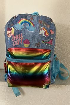 nickelodean  girl's backpack Colorful Large front pocket Adjustable strap Mesh pockets on both sides Condition is great Measurement - height 16" width 12" depth 5" Casual Rainbow School Bag, Cute Rainbow School Bag, Cute Rainbow School Bags, Fun Multicolor Student Backpack, Playful Rainbow School Bag, Multicolor School Backpack With Zipper Closure, Fun Multicolor Backpack For Back To School, Rainbow-colored Standard Backpack For School, Rainbow School Backpack