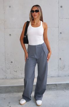 Level up your streetwear outfit in the One For The Team Pants Charcoal. Features a thick waist band with hidden front zipper and clasp closure, wide leg fit, lined fabric, belt loops, two pocket detailing and full length. Style with a white tank top and sneakers for an off duty vibe! 67% Polyester 29% Rayon 3% Spandex Team Pants, Easy Trendy Outfits, Fabric Belt, Short Leggings, Maxi Dress Party, White Fox, Streetwear Outfit, White Tank Top, Sports Leggings