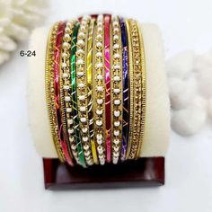 Unlock the beauty within, let these elegant Multicolored bangles tell your story. Multicolor Bangle For Party, Elegant Multicolor Festive Bracelets, Elegant Multicolor Bridal Sets For Festive Occasions, Elegant Multicolor Bangle For Celebration, Elegant Multicolor Bracelets For Festive Season, Multicolor Festive Bracelet Jewelry, Elegant Multicolor Bridal Sets For Festivals, Multicolor Bollywood Bracelet Jewelry, Multicolor Bollywood Style Bracelet Jewelry