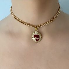 Are you looking for the perfect necklace for this fall season? My red and gold sacred heart choker necklace is a unique piece of handmade jewelry to wear and to gift! Inspired by my love for sacred heart jewelry and unique anniversary gift ideas, my thick gold chain choker necklace is the perfect compliment to any outfit idea. My red heart choker is a great gift idea for any special occasion to all the women in your life! You can't go wrong when gifting my Mexican heart necklace to your mother, Gold Heart Shaped Clavicle Chain Choker, Valentine's Day Heart Pendant Choker With Clavicle Chain, Valentine's Day Heart Pendant Clavicle Chain Choker, Valentine's Day Gift Choker With Clavicle Chain, Valentine's Day Gift Clavicle Chain Choker, Valentine's Day Heart Choker Necklace, Gold Metal Heart Choker Necklace, Valentine's Day Heart Choker Necklace With Adjustable Chain, Metal Clavicle Chain Choker For Valentine's Day