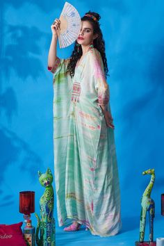 Mint, multi color tie dye kaftan with pleats and embroidery on the waist.
Component: 1
Pattern: Tie Dye and Embroidery
Type Of Work: Thread and Beads
Neckline: V neck
Sleeve Type: Kaftan Sleeves
Fabric: Cotton Silk
Color: Green,Multi Color
Other Details: 
Embroidered cuffs
Bead tassels
Occasion: Resort - Aza Fashions Multicolor Silk Beachwear Kimono, Multicolor Silk Kimono For Beachwear, Multicolor Tassel Kaftan For Vacation, Multicolor Vacation Kaftan With Tassels, Spring Multicolor Kaftan With Tassels, Multicolor Tasseled Kaftan For Vacation, Multicolor Kimono With Tassels, Multicolor Kimono With Tassel Details, Multicolor V-neck Kaftan With Batik Print