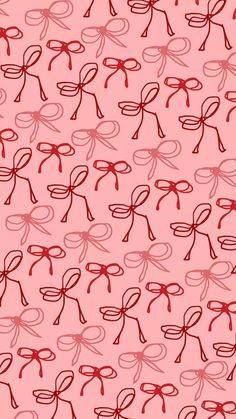 a pink background with red bows on it